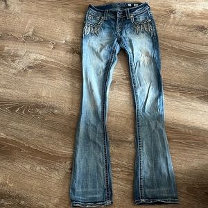 Feathered miss me jeans